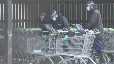Police examine trolleys at a Co-op in Sandwich, Kent